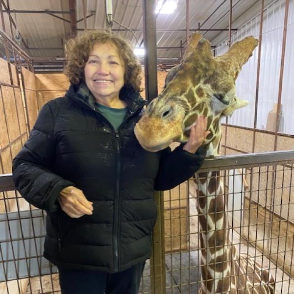 Shelly Mullett and giraffe at The Wilds